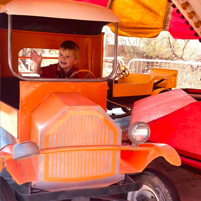 Child-riding-antique-car